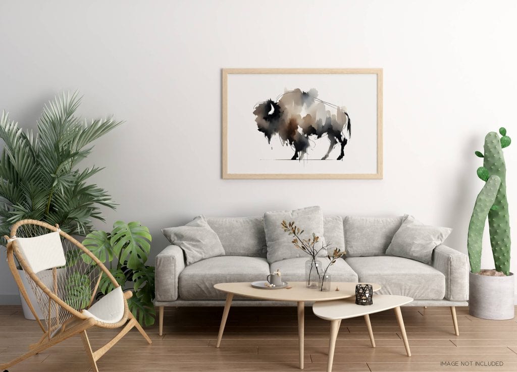 Minimalist living room interior featuring an abstract watercolor bison (buffalo) print in neutral earth tones, framed in light wood and hanging above a contemporary beige sofa with indoor plants.