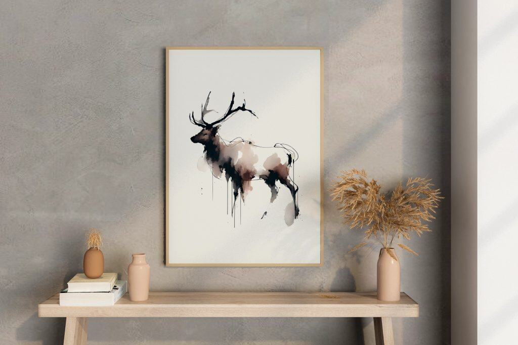 Minimalist interior featuring a framed abstract watercolor deer artwork in soft neutral tones above a simple wooden console.