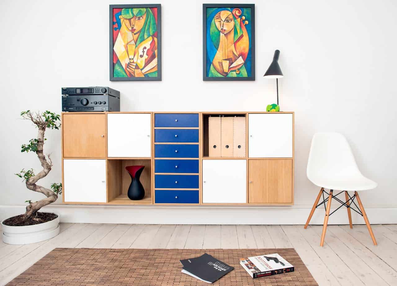 services-03 Contemporary room design featuring colorful artwork, sleek furniture, and decorative elements.